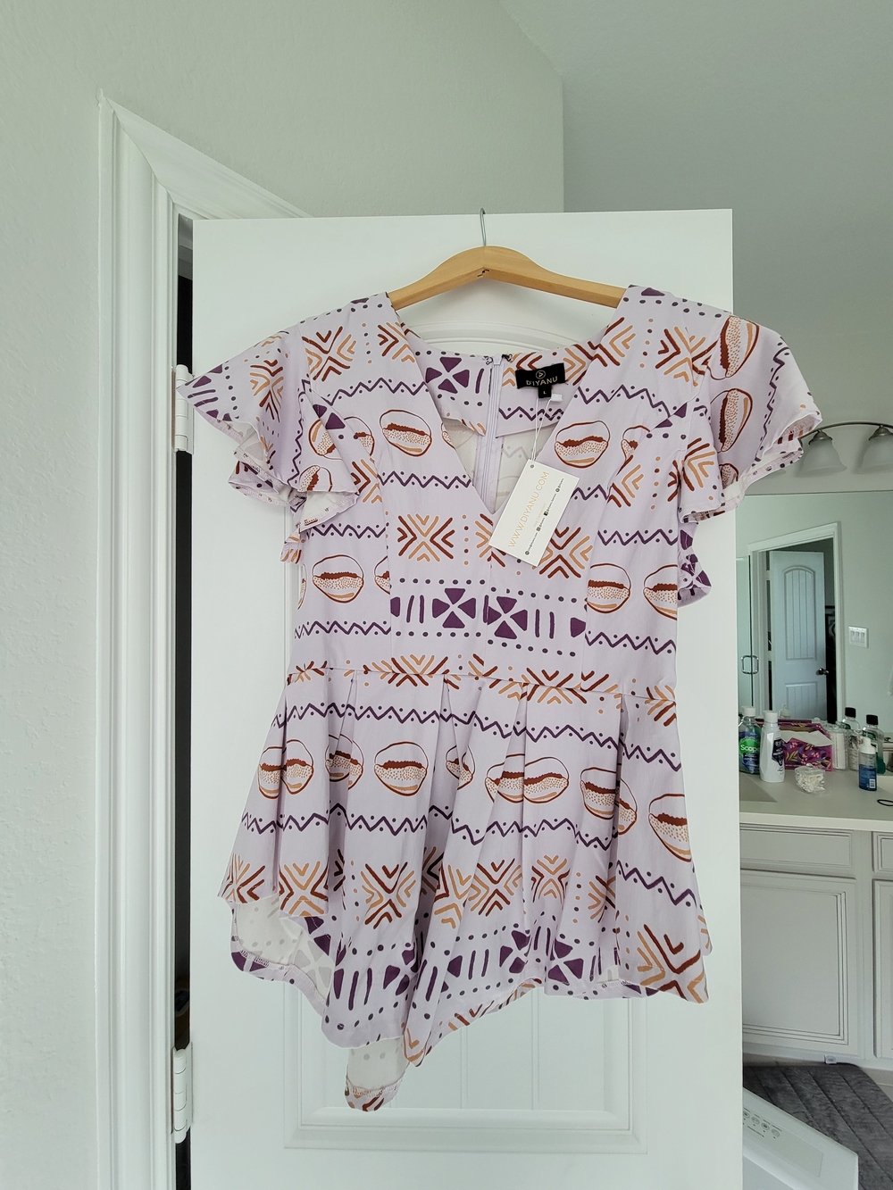 NWT - Lilac Geometric & Lip-Print Flutter Peplum Top
